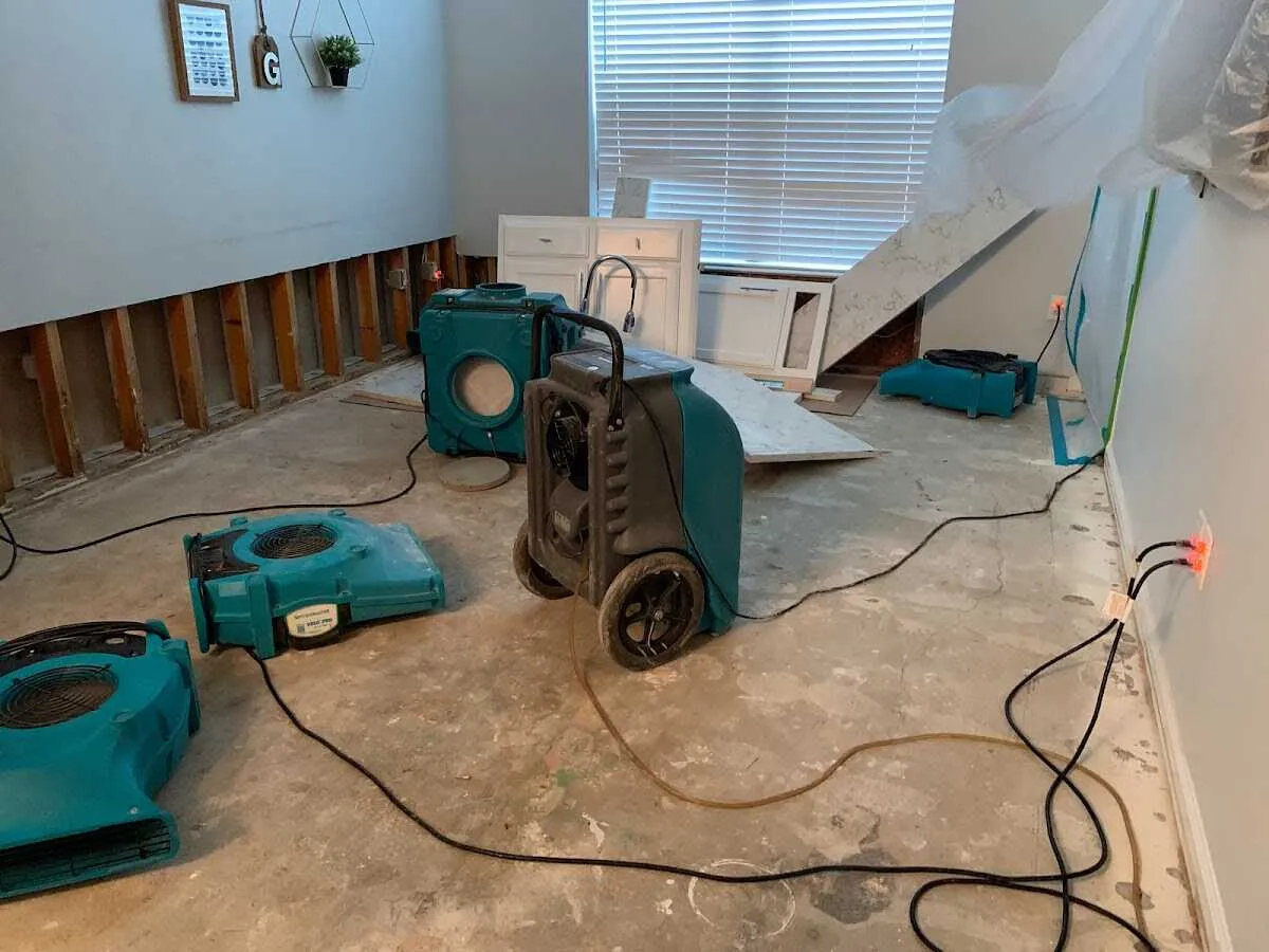 Dehumidifier in flood-cut room for Water Damage Restoration in Easton